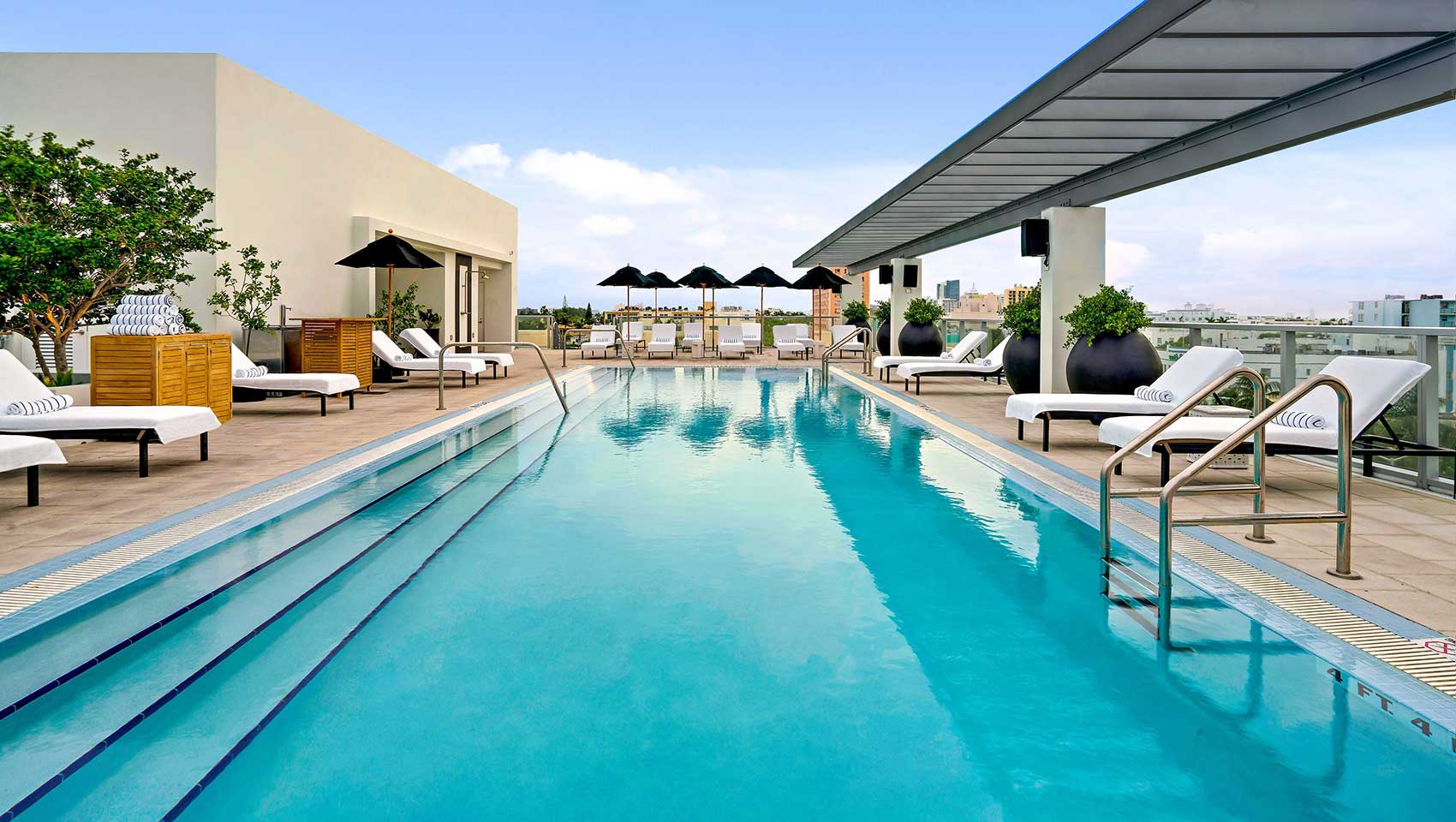 Rooftop pool and deck chairs at Kimpton Angler’s Hotel
