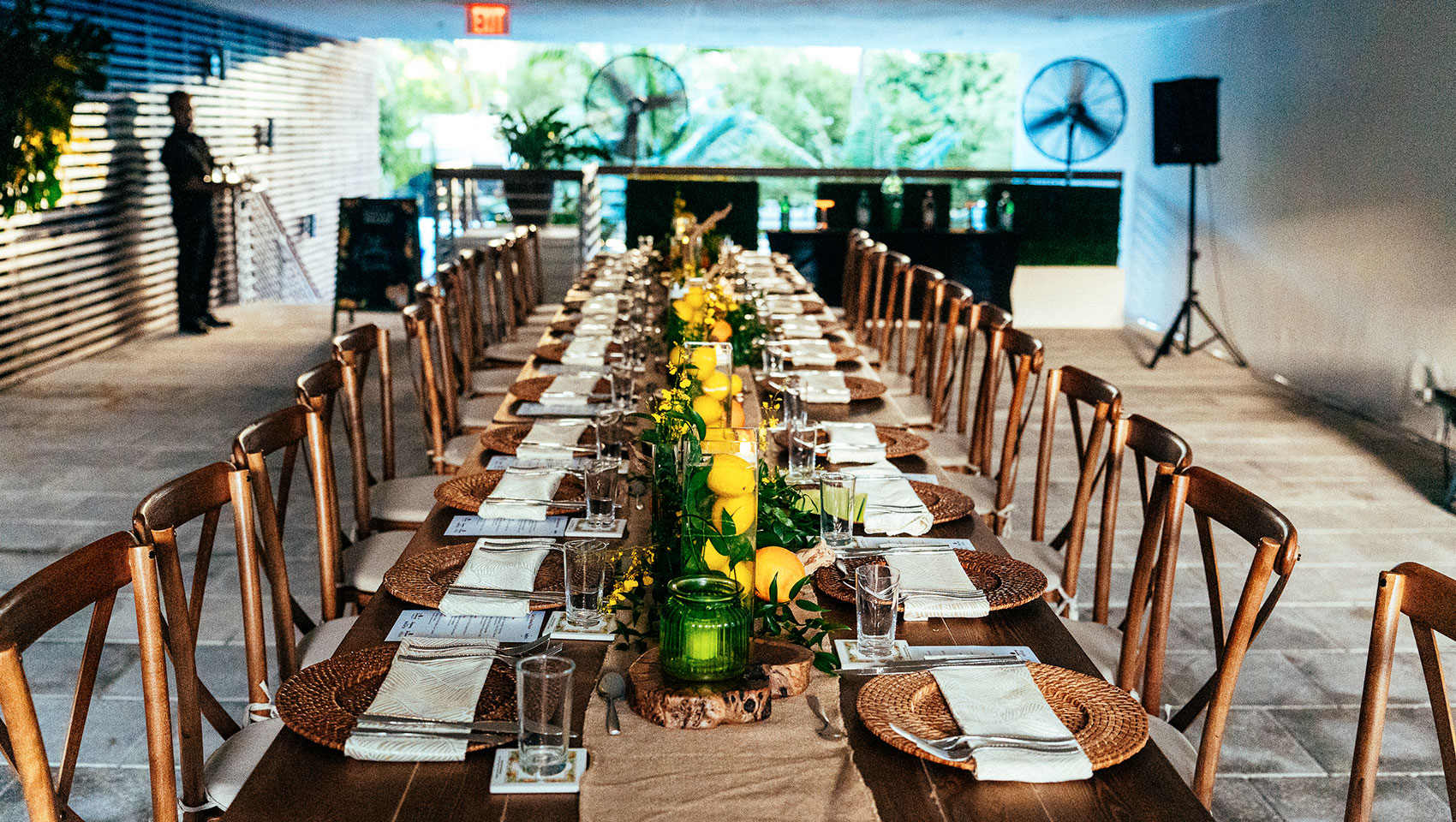 kimpton anglers breezeway with a long table with plates and glasses set for a social event