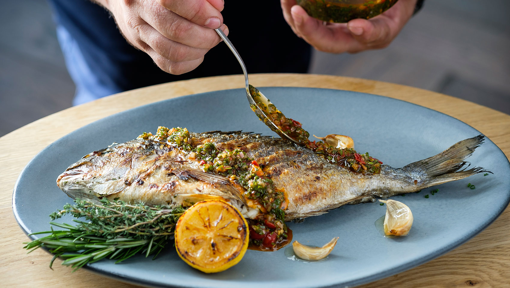 seawell's chef seasoning a fillet fish