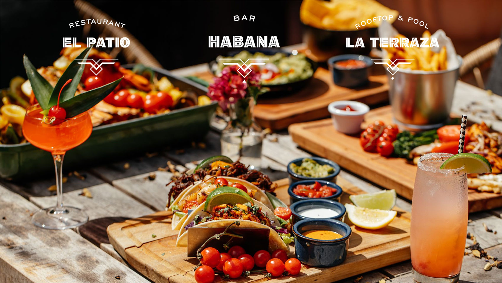 spread of food on a table with 3 logos of the Hotel's restaurants