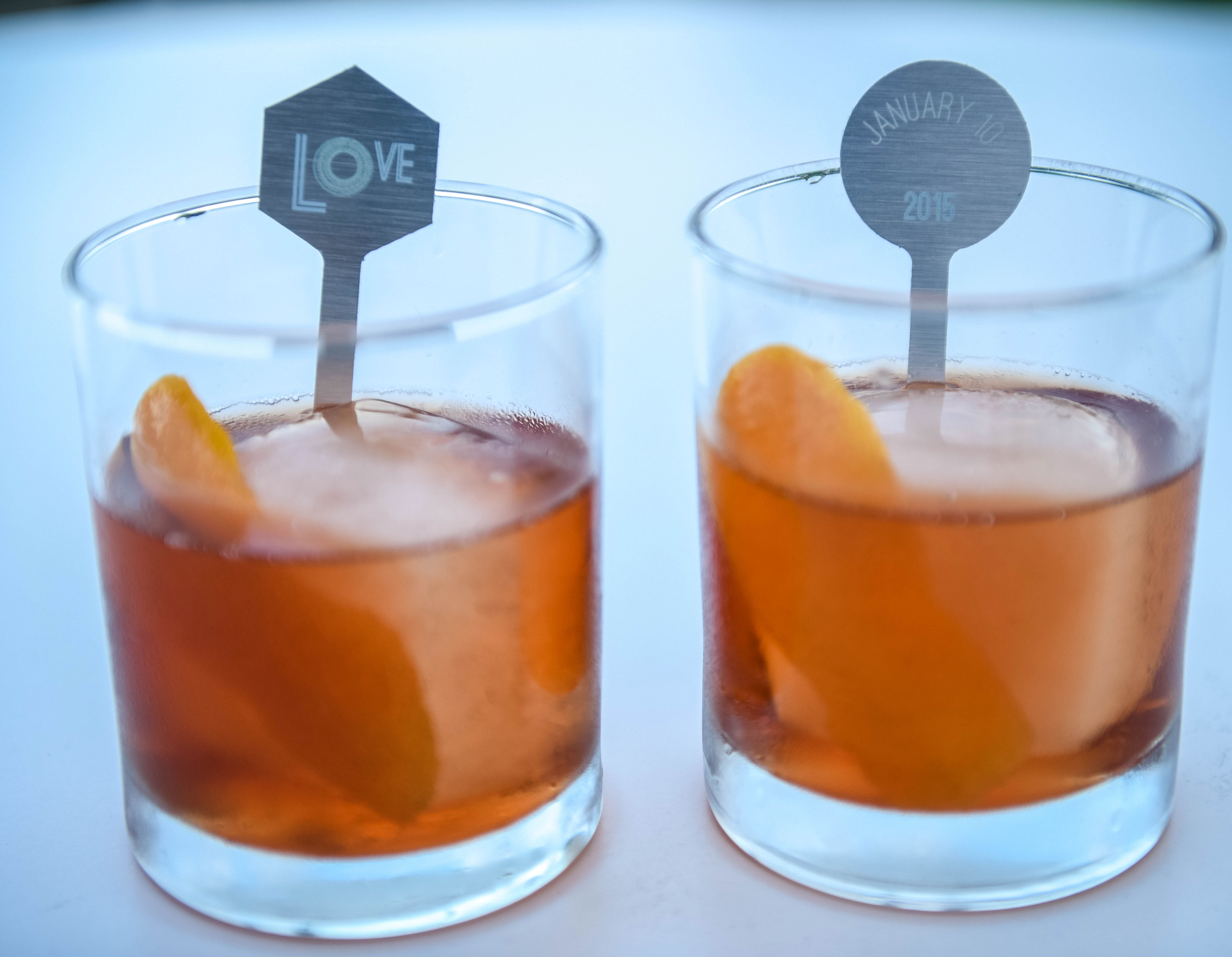 two short cocktail glasses filled with a craft cocktail