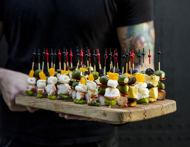 hors d'oeuvres on a wood serving plate
